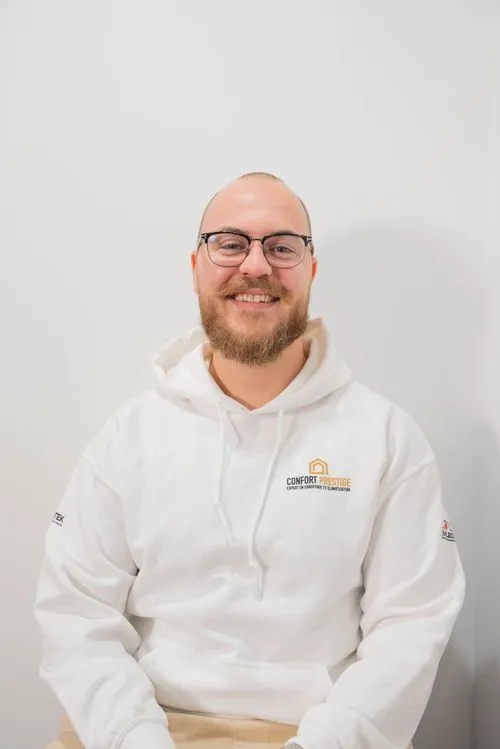 A man wearing glasses and a white hoodie with the words comfortable properties on it.