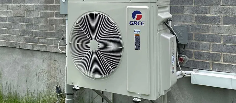 A white air conditioner with a blue and red logo.