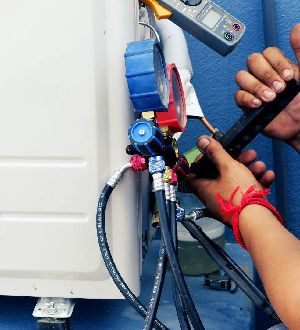 A man is working on a water heater.