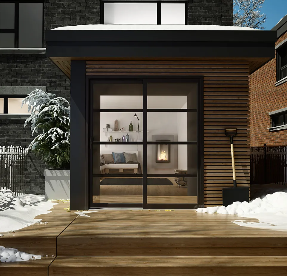 A small house with a fireplace and a patio.