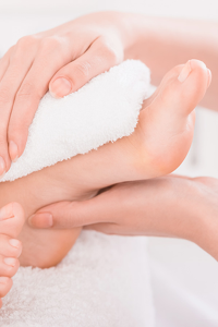 Closeup of a foot receiving a pedicure at Complexion Medspa Cobourg