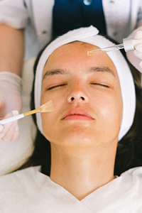 Woman receiving a signature facial at Complexion Medspa Cobourg