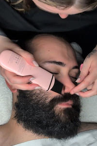 Man receiving a deluxe facial at Complexion Medspa Cobourg