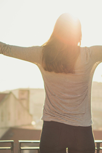 Am image of a woman who's enjoying a full happy life because of the freedom Complexion Medspa Cobourg life coaching provides