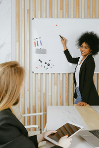 An image of a woman being given career coaching at Complexion Medspa Cobourg