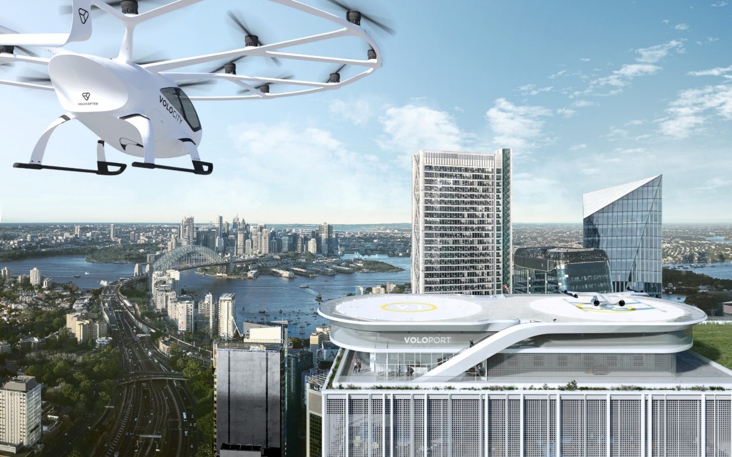 A eVTOL (electric helicopter) flies across the city to land at a vertiport in the city.