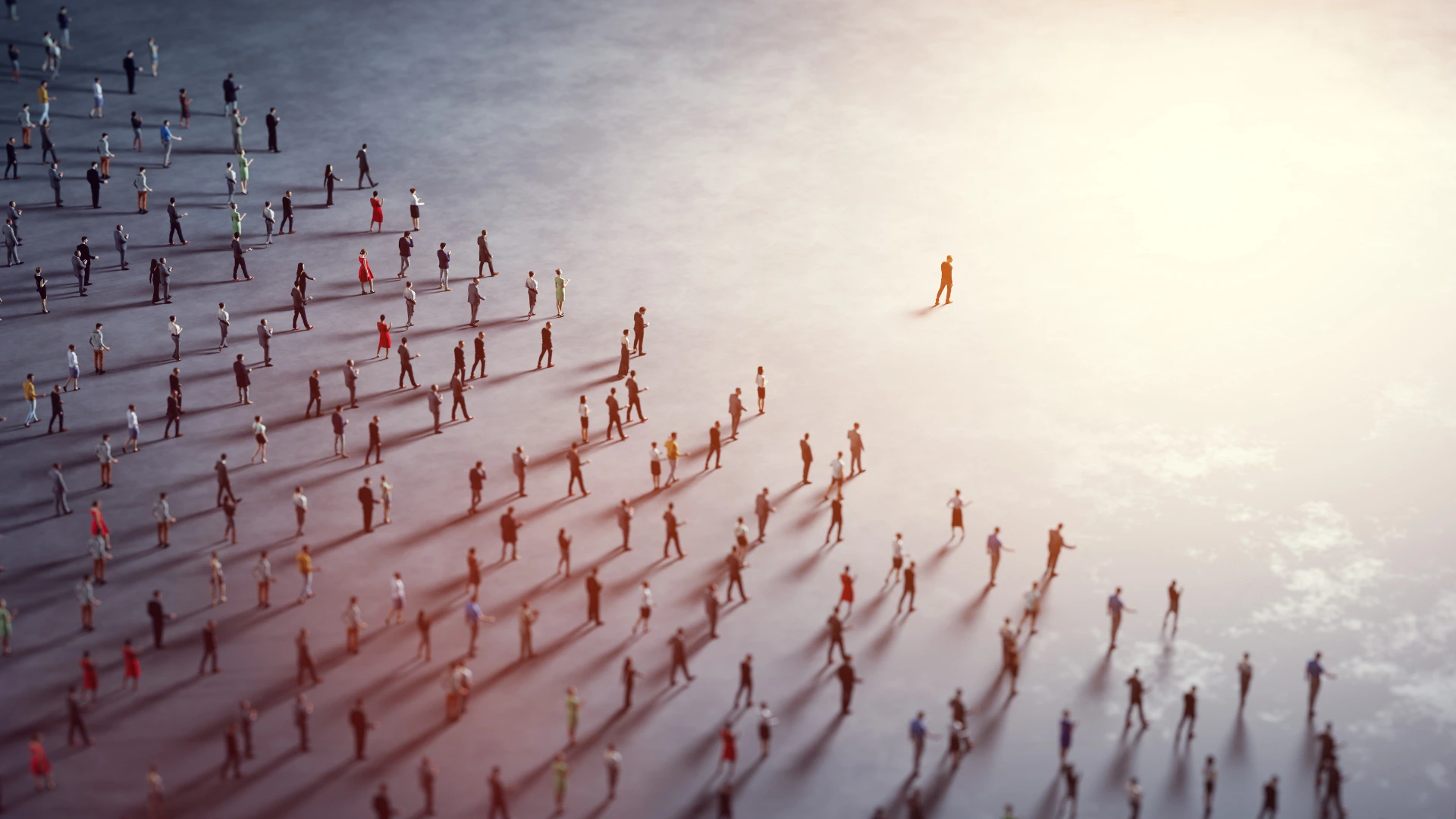 A throng of people follow a single leader through the mist