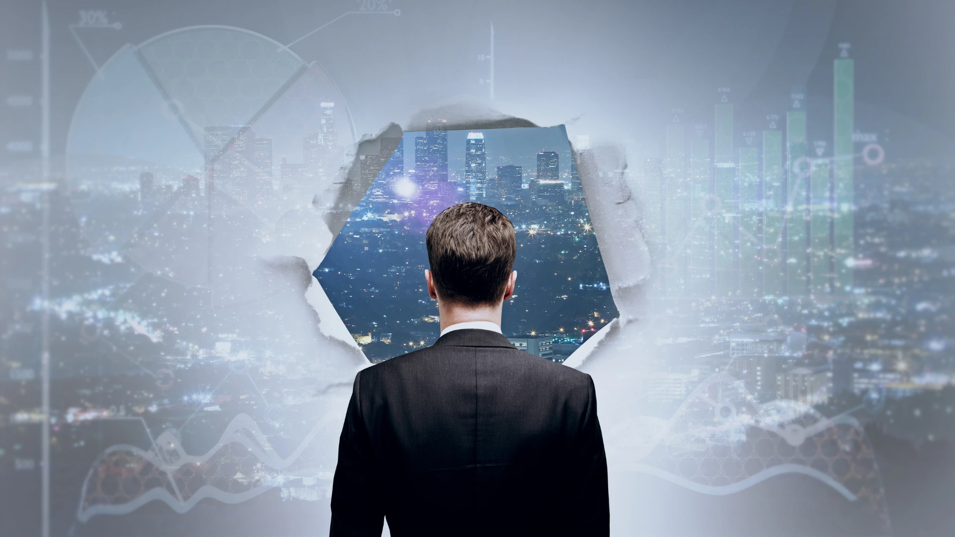 A man stares off behind a wall with a hole torn through so he can city the city beyond