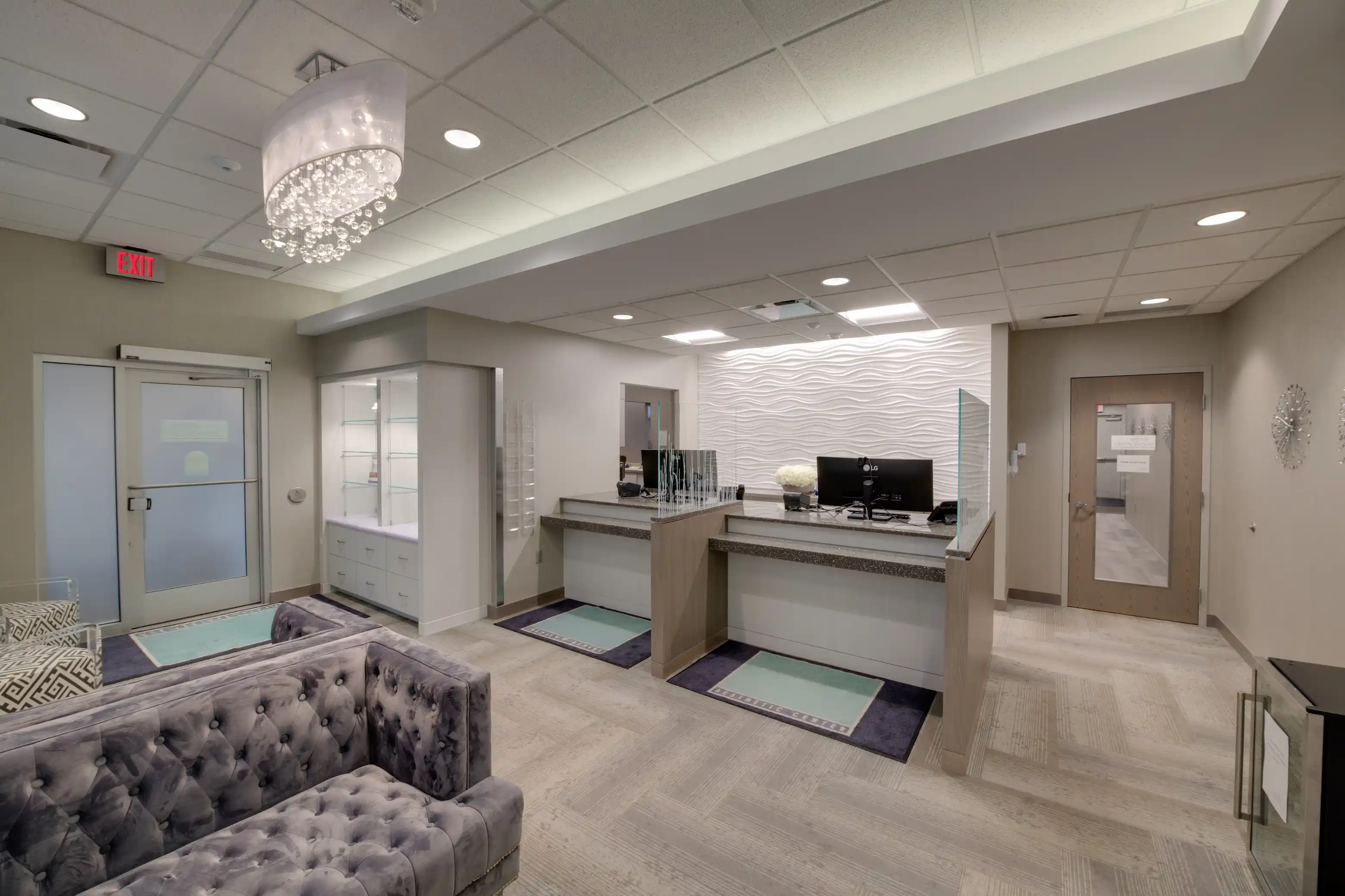 Bright, modern dermatology lobby with minimalist décor and soft lighting, creating a welcoming and calming environment for skincare patients.