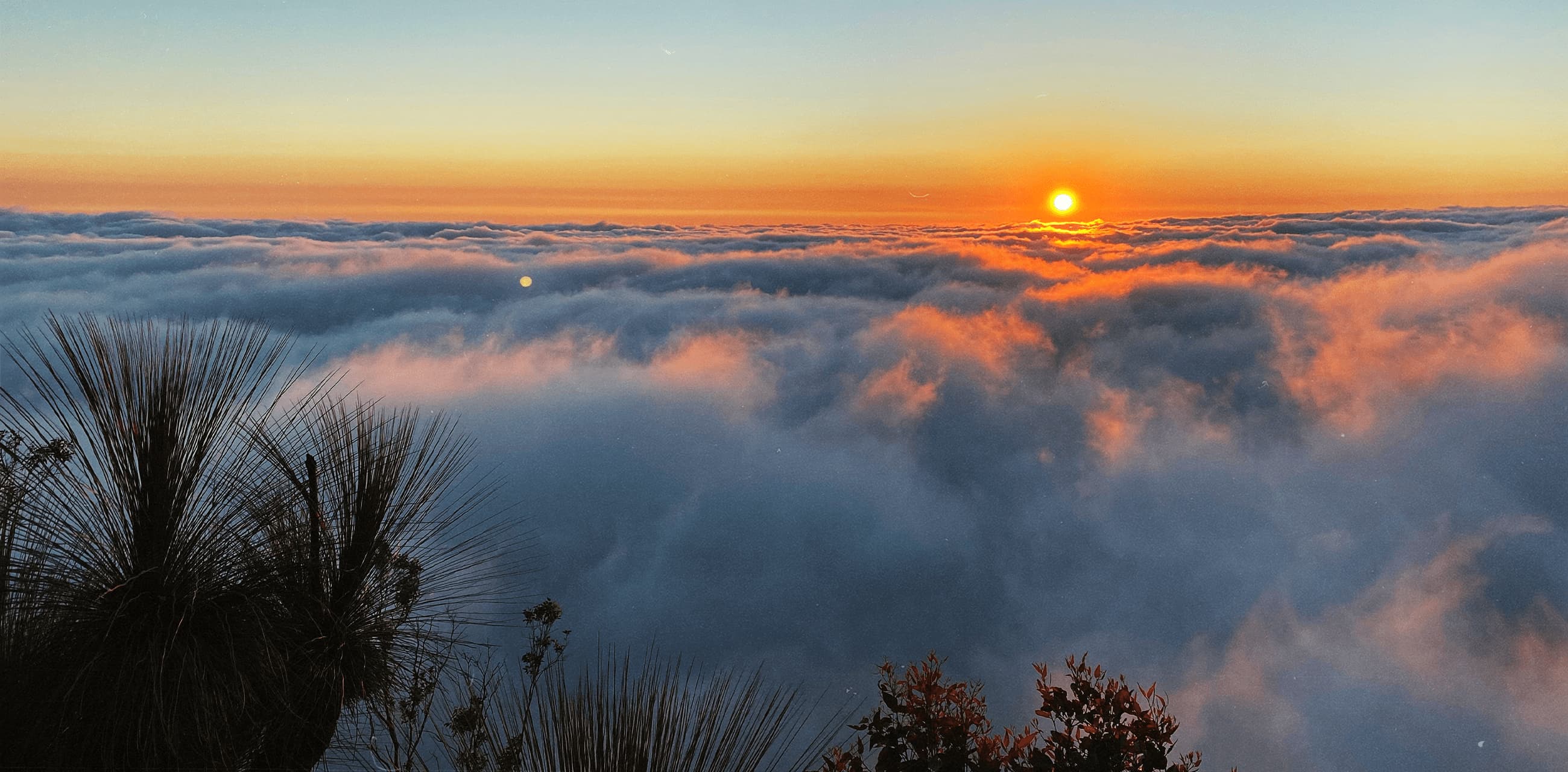 sunrise above clouds in australia