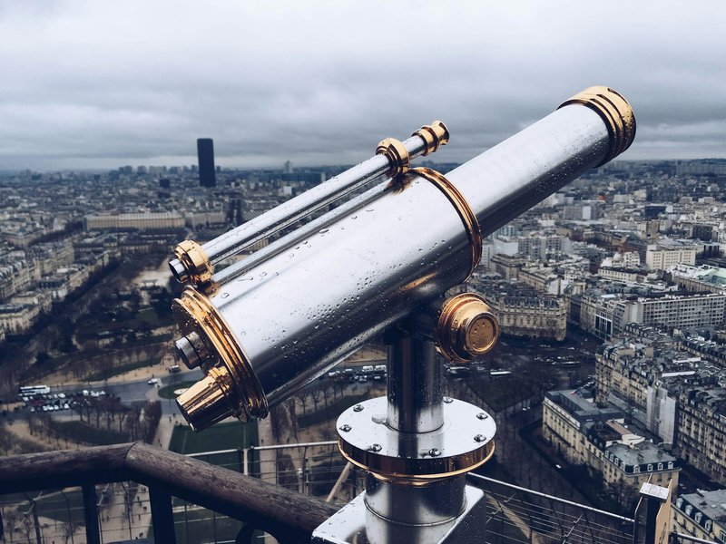 a telescope for viewing atop a skyscraper symbolizing how building grant funder relationships can lead to long-range sustainability