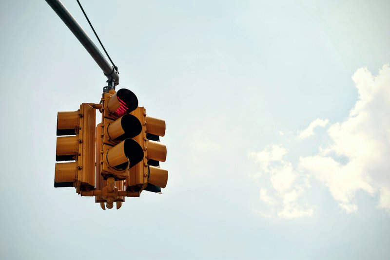 a stoplight mirroring the framework of AI, hybrid, and human led grant writing efficiency tasks