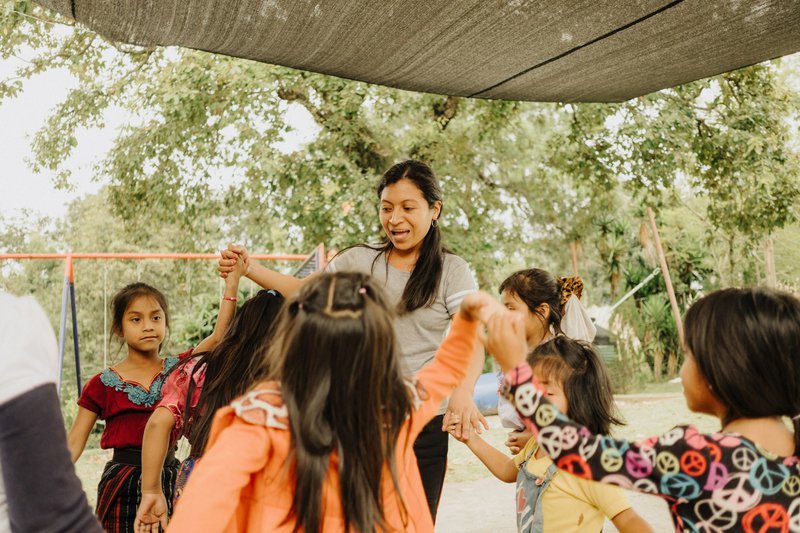 a woman leading a dance with children at the nonprofit she leads, she&#39;s thinking &#39;what is a grant?&#39;