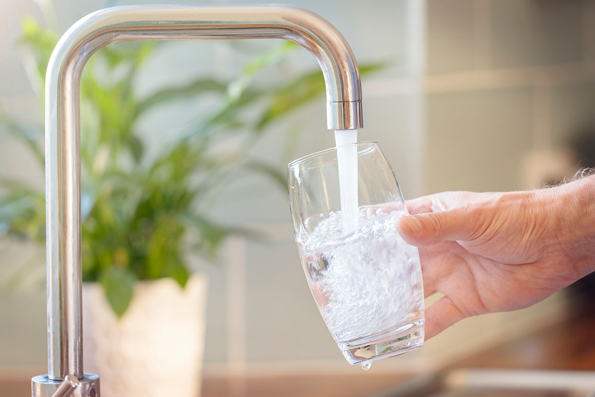 pouring a glass of water from the faucet