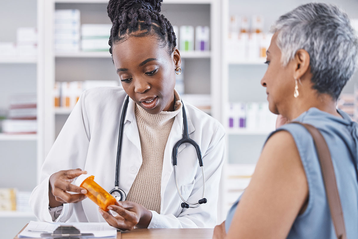Woman talking to her doctor about medication side effects
