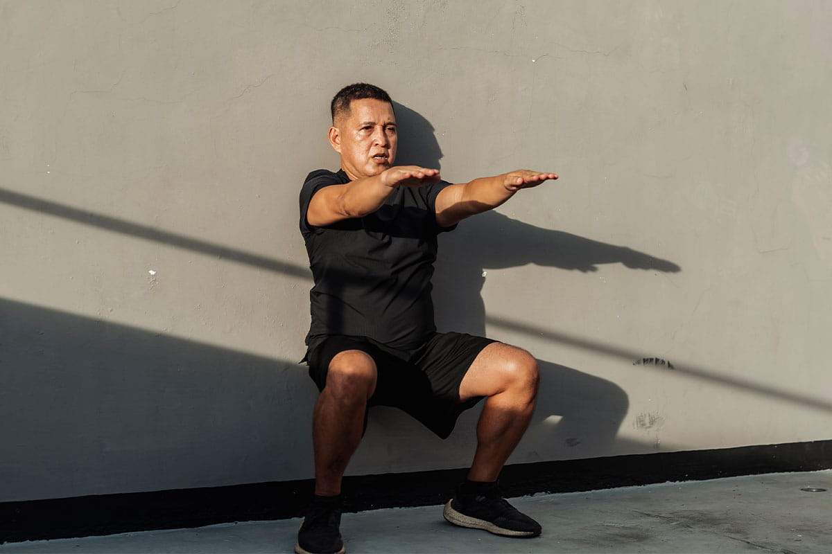 Man doing wall squats