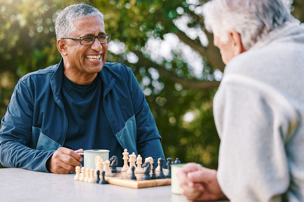 Two men enjoying chess outside
