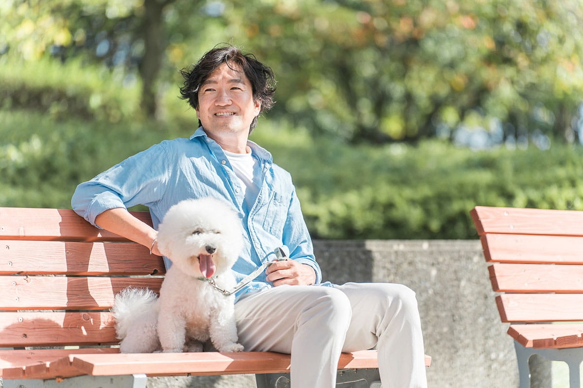 Man on bench with dog