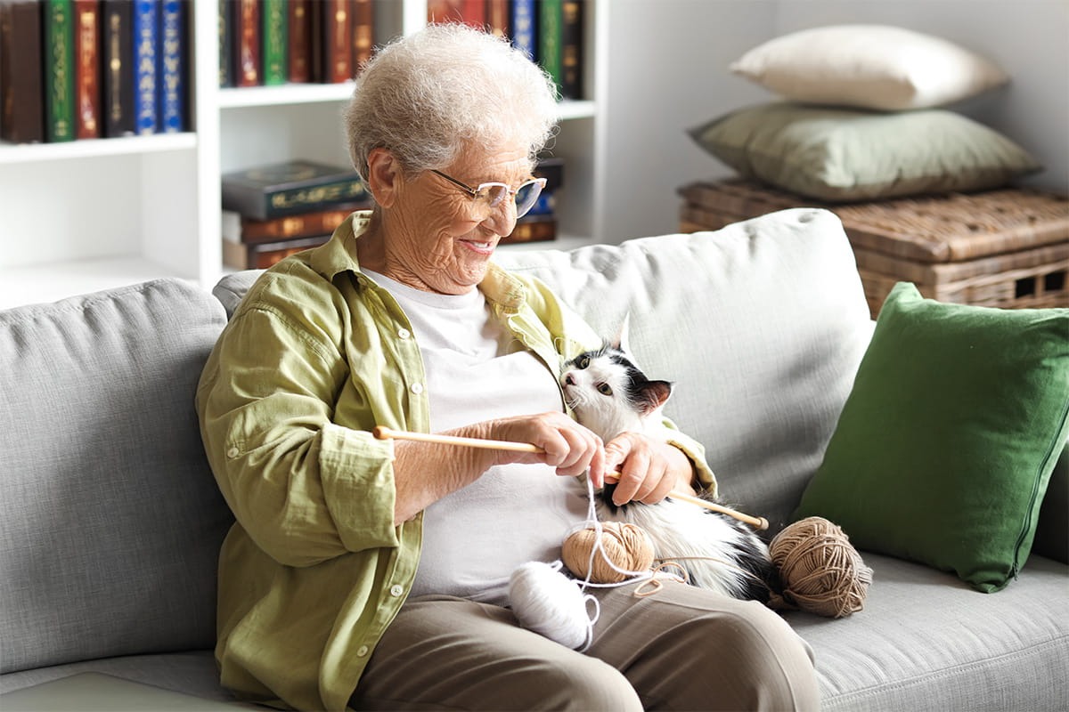 Elderly woman and cat