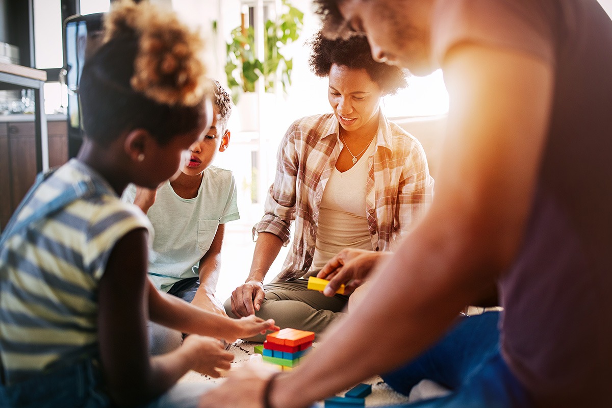 Young family playing a game together
