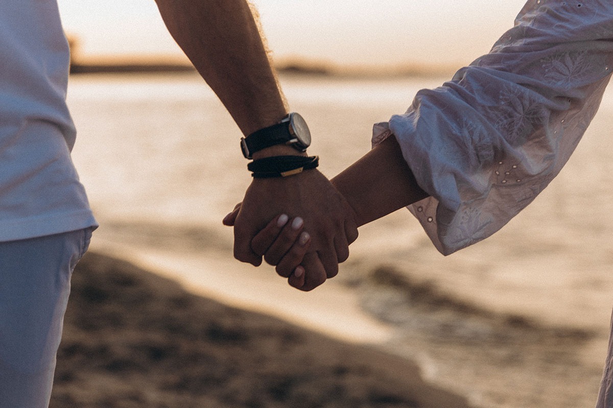 Couple holding hands