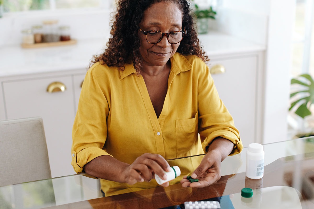 woman taking medication