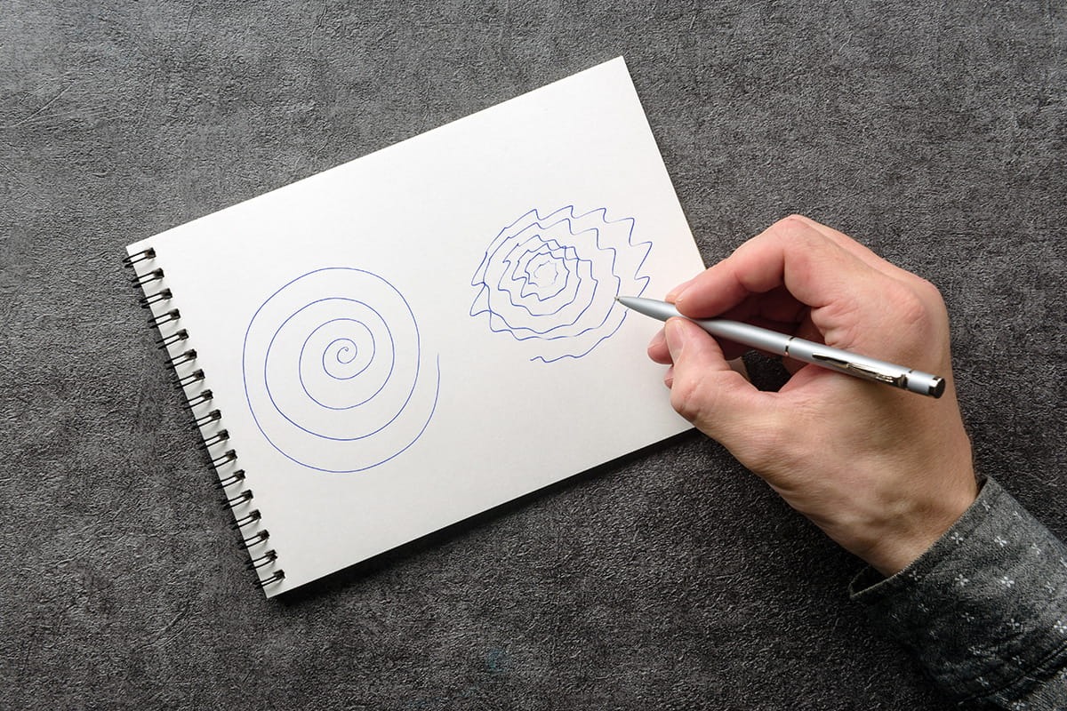 Person writing on a notepad
