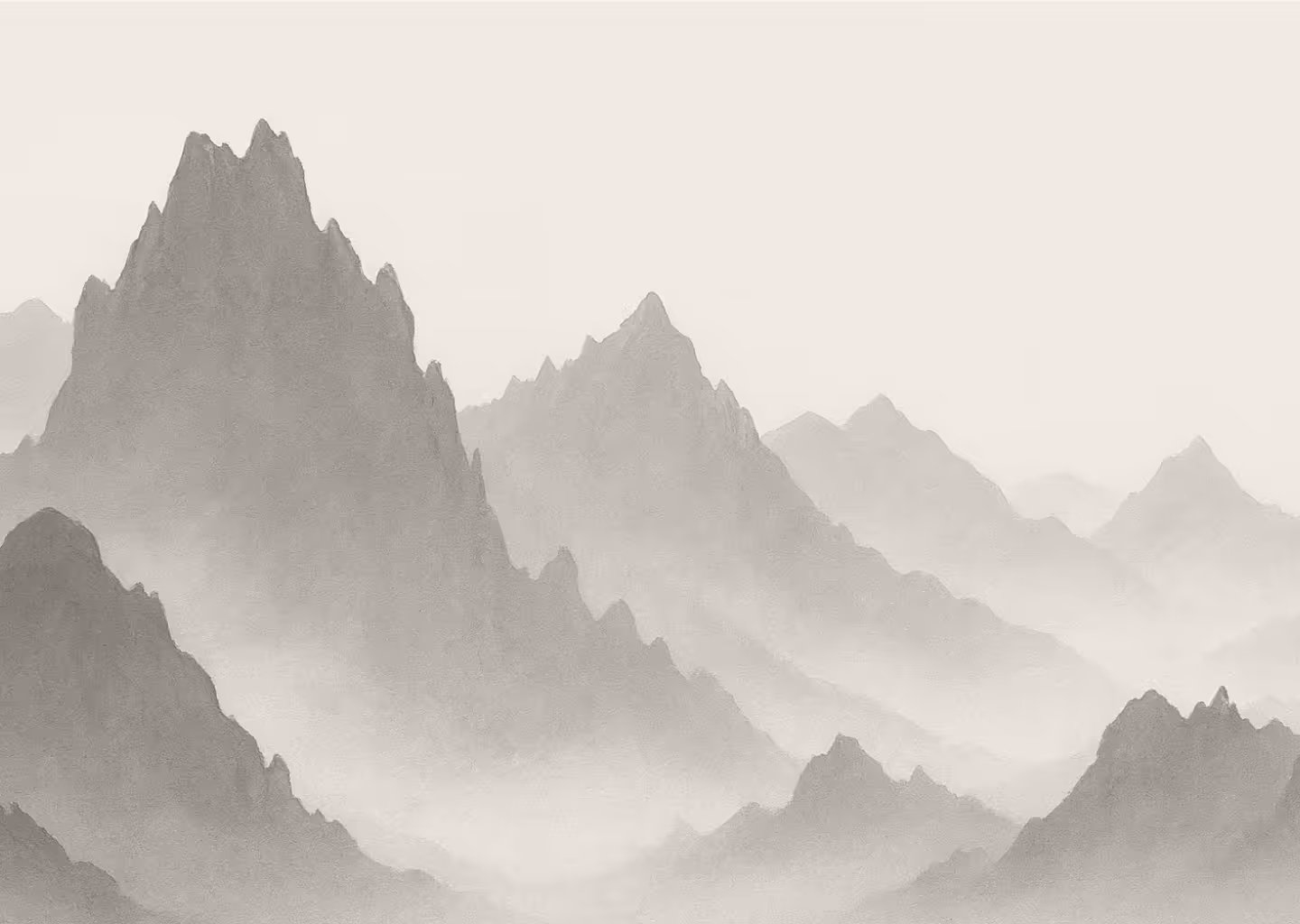 Monochrome misty mountain range with layered peaks fading into the distance.