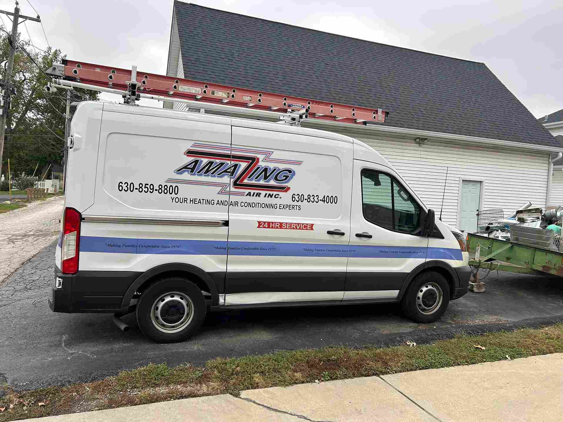 People at a desk signing document with pen, close-up view