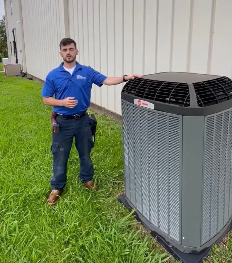 HVAC technician performing maintenance on a heating and cooling system