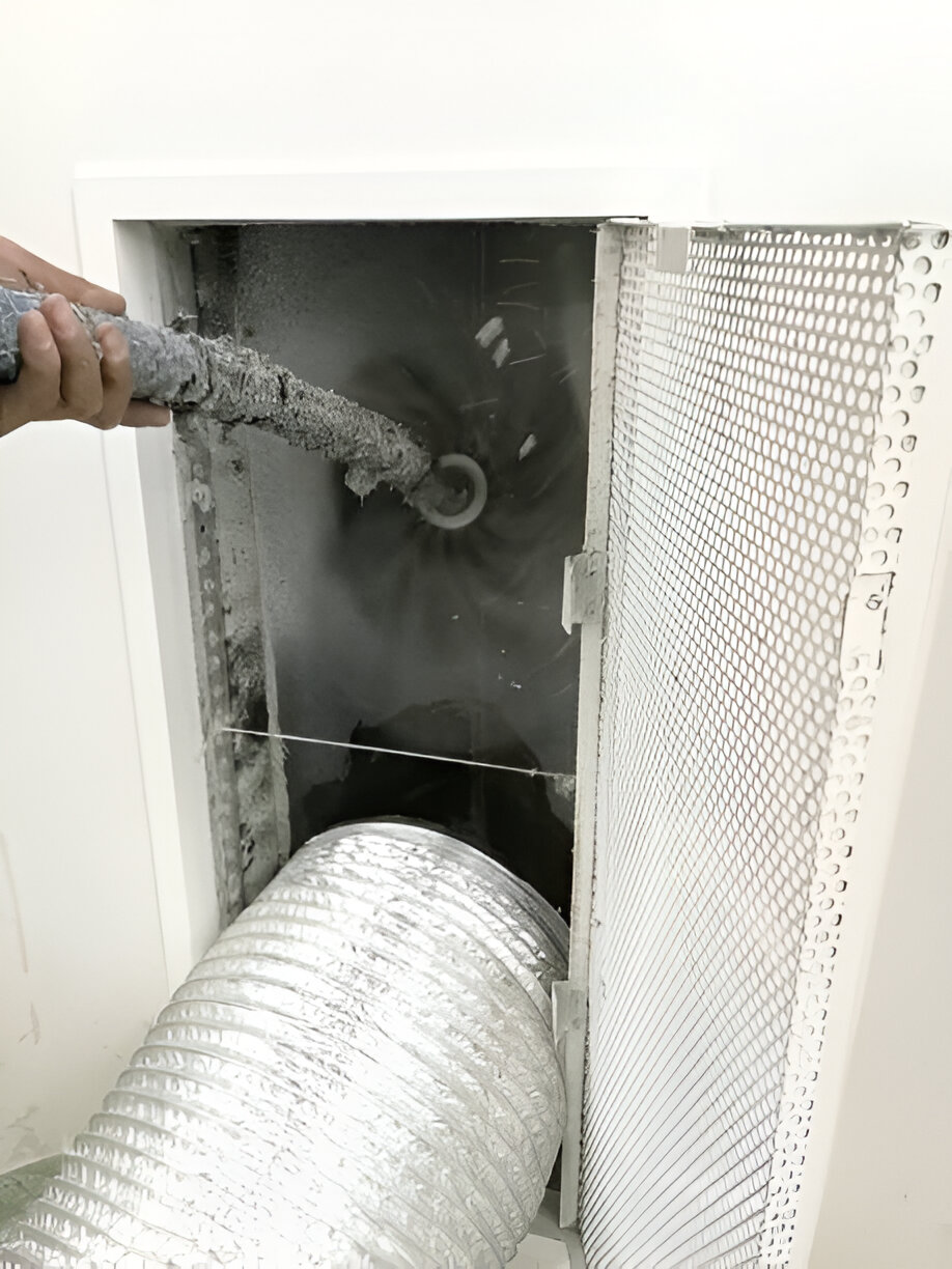 Cleaning dryer vent with brush inside metal ductwork and protective screen