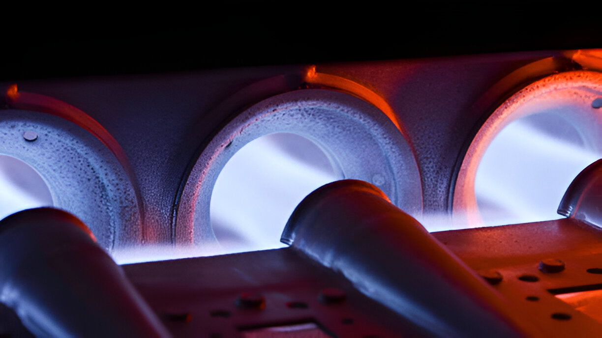 Glowing industrial heating elements with blue and orange light