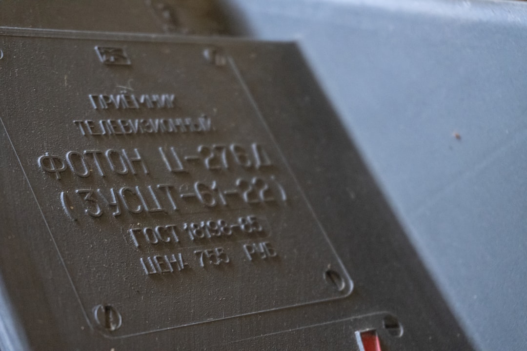 Close-up of an AC data plate showing manufacturing date and refrigerant type