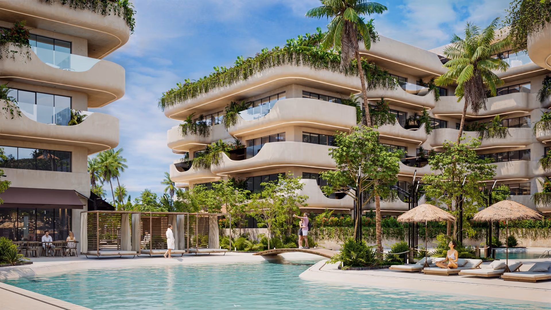Modern residential complex with curving balconies adorned with green plants, a large swimming pool in the foreground, palm trees, and people relaxing and walking near the pool.
