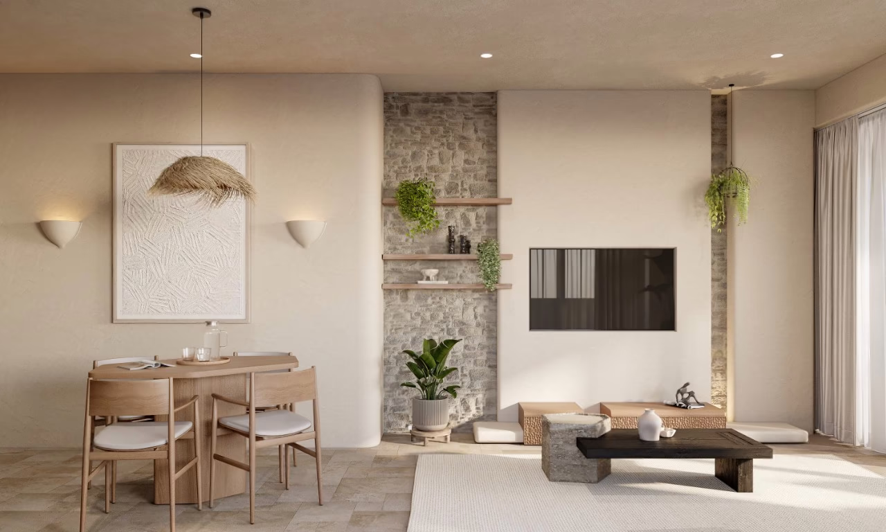 One bedroom apartment at Azure Paje: dining table and living area with a stone feature wall