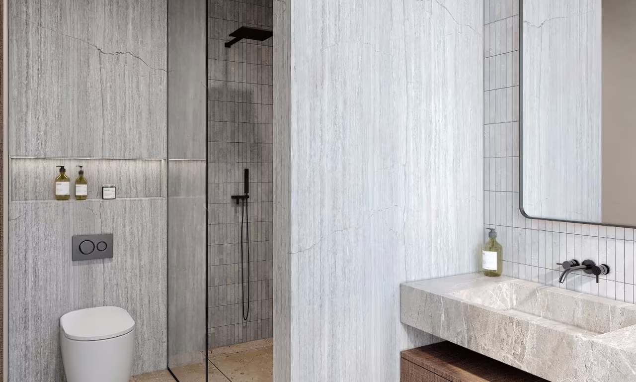 2 Bedroom Penthouse at Azure Paje: second bathroom with a marble vanity and glass shower