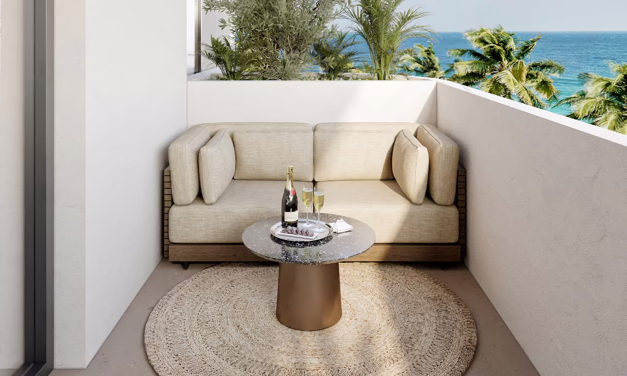 Two bedroom apartment at Azure Paje: furnished balcony with a sofa and a view of the sea