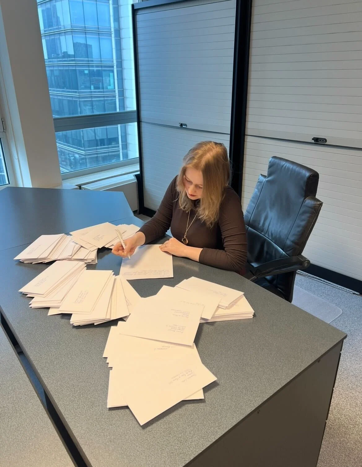 Picture of Tatiana writing a letter.