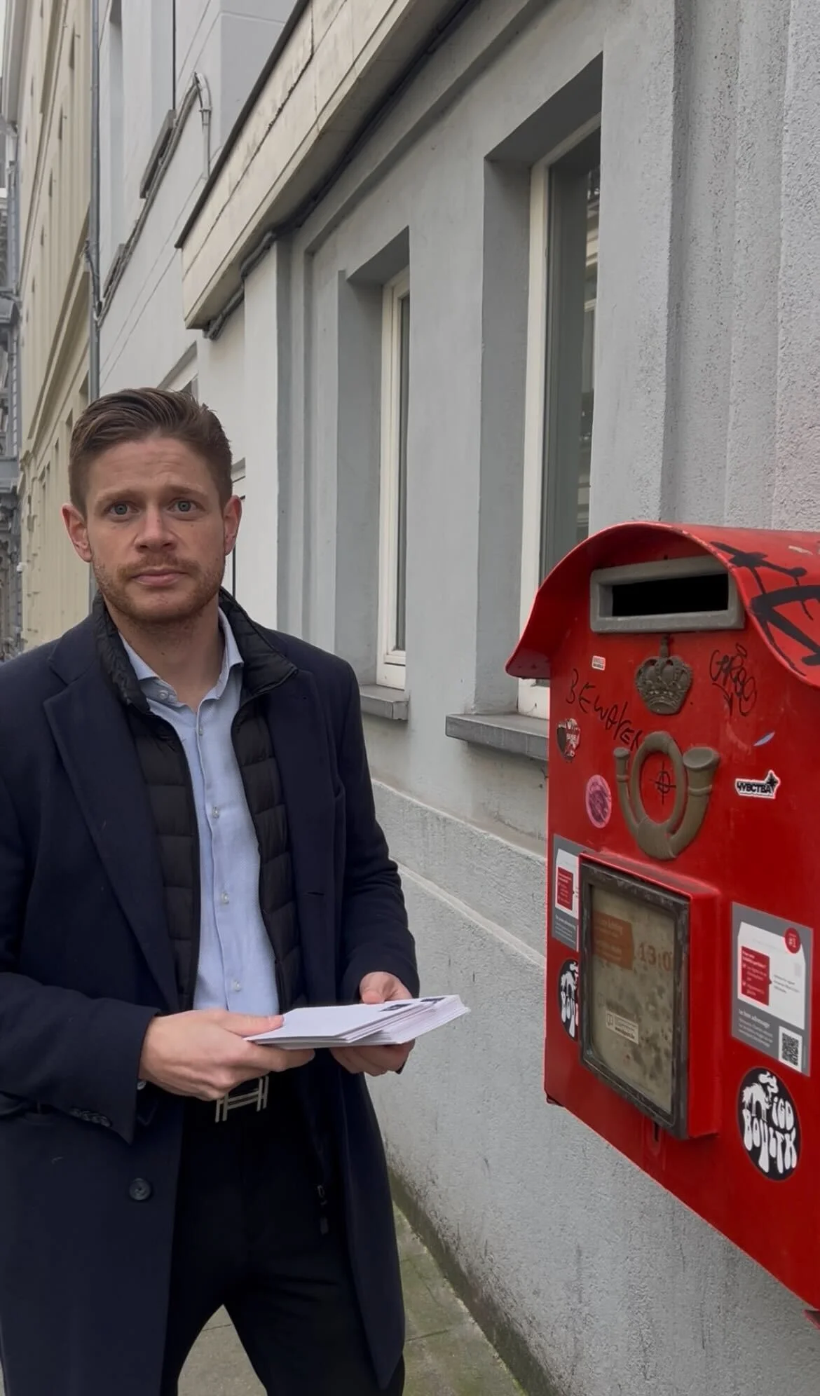 Picture of Florian posting the letters.