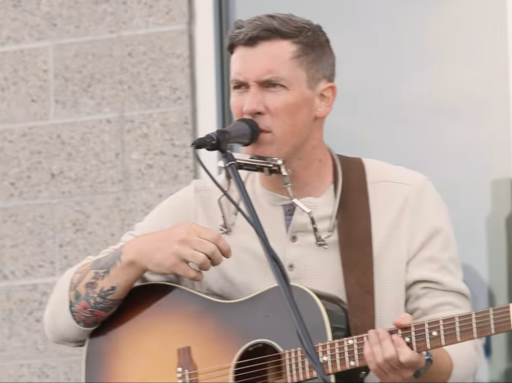 Live acoustic musician performing at Idaho Air & Coffee event.