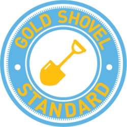Gold shovel icon centered within a blue circular badge with the text 'GOLD SHOVEL STANDARD' around the edge.