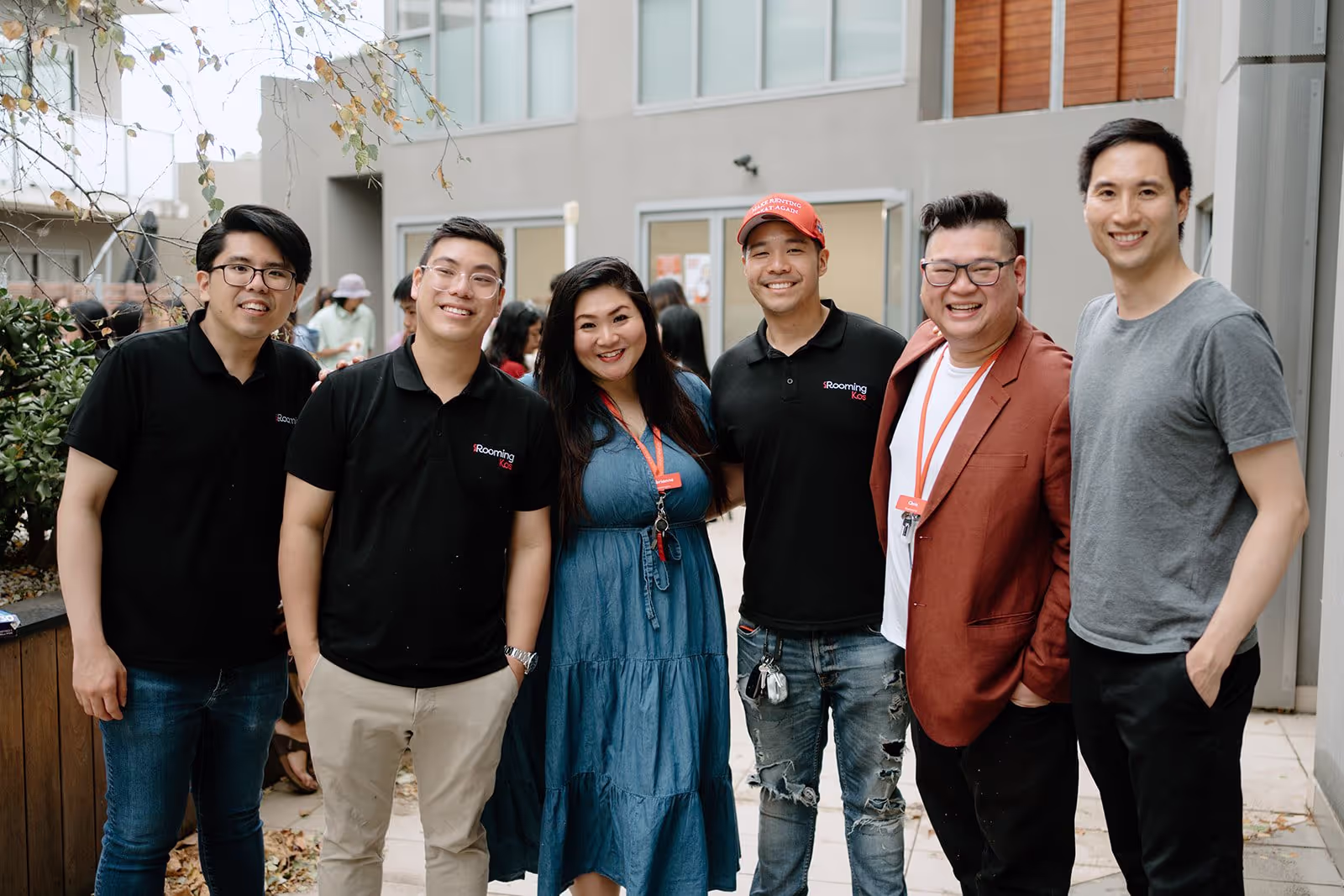 A group of young professionals smiling at the camera