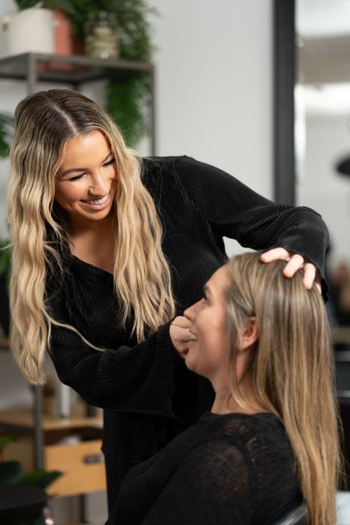 Aleesha Pearson, owner of Whip-Lash Cronulla, checking the brows of Harmony Tera, founder of Swapp, during a brow appointment.