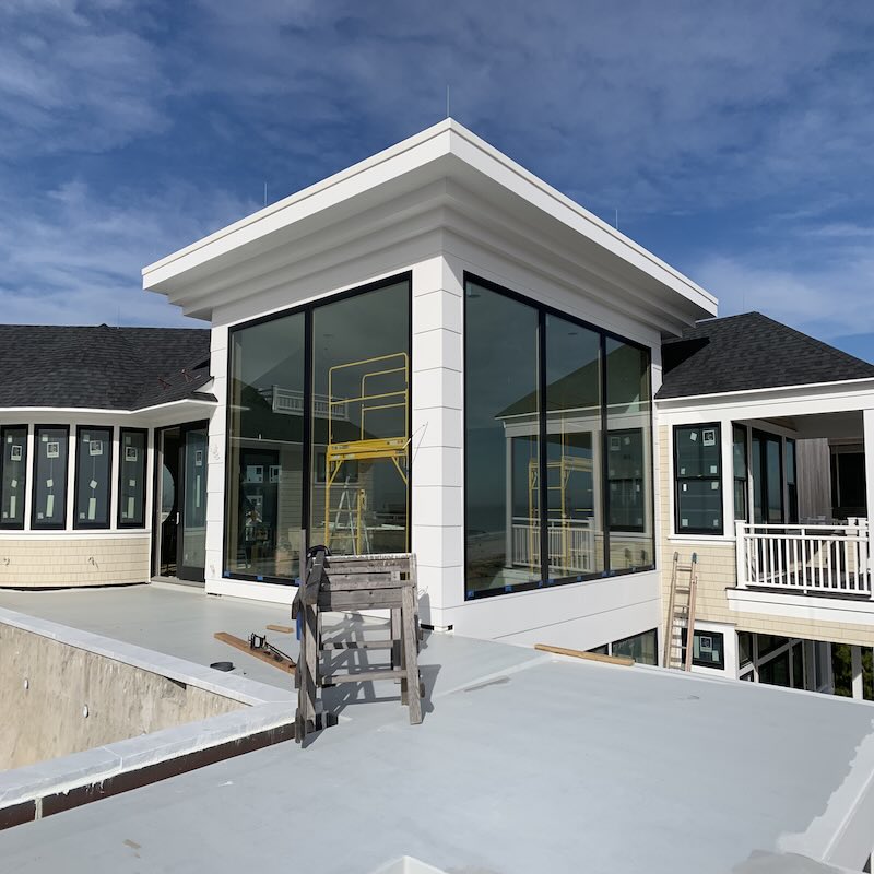 Custom Weiland glass wall system engineered for a large coastal opening