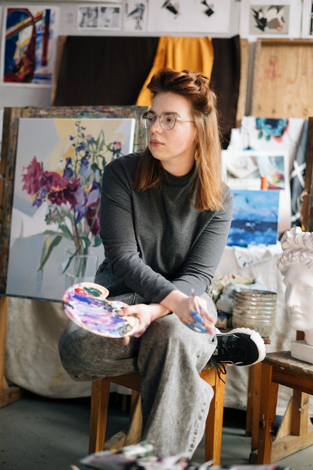 A painter getting interviewed. 