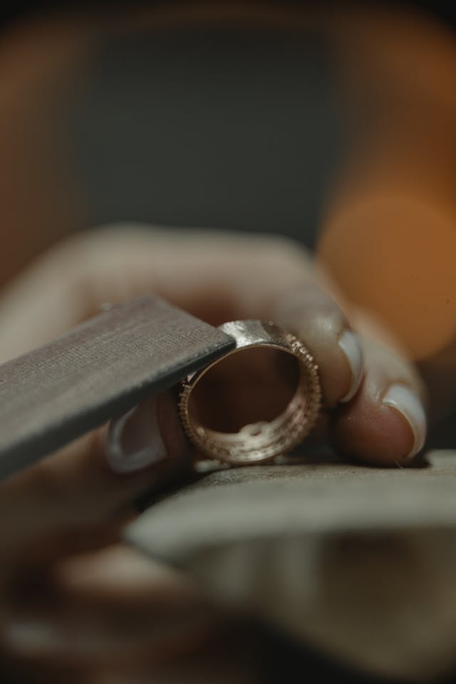 Image of a hand creating jewellery.