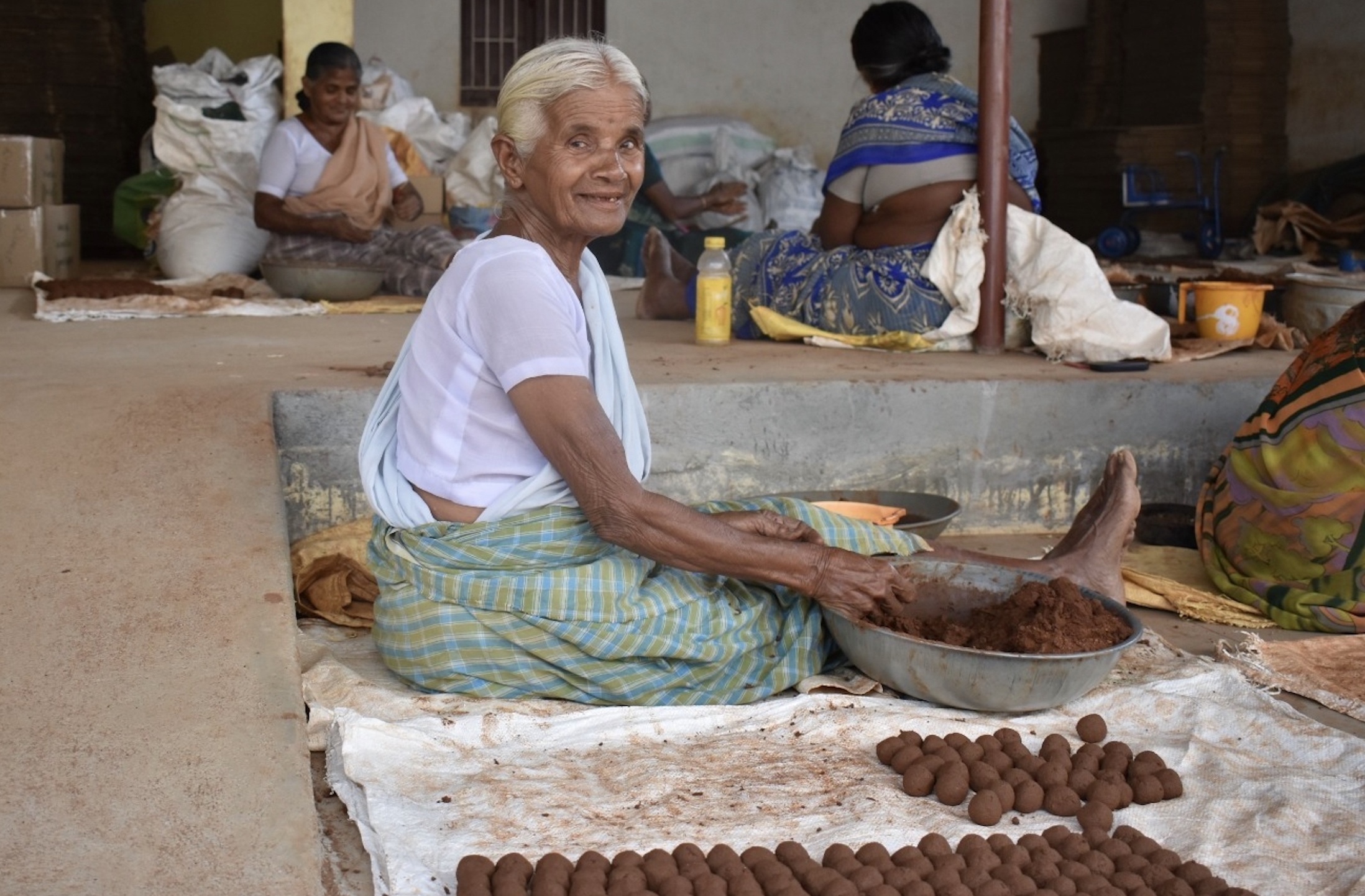 Woman artisan making seed balls