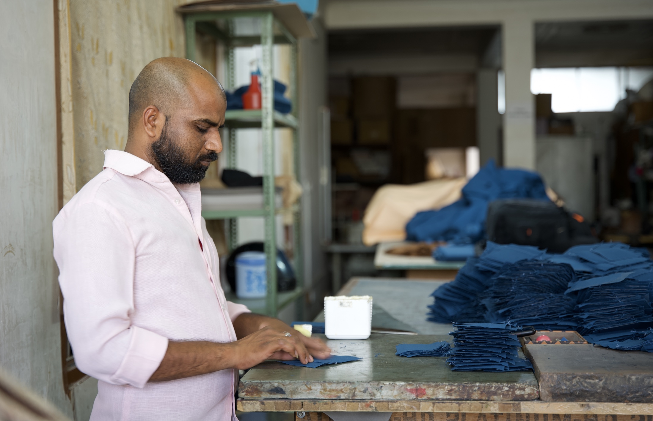 Artisan making ID Badge lanyard by hand