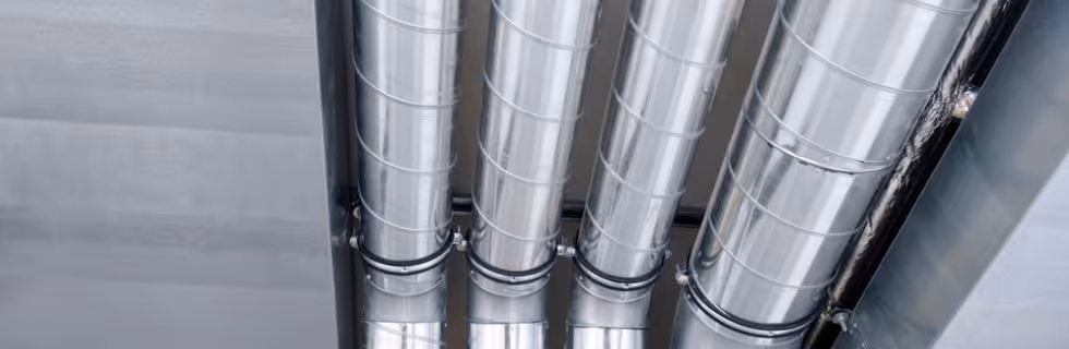 Shiny metallic industrial pipes connected with circular joints