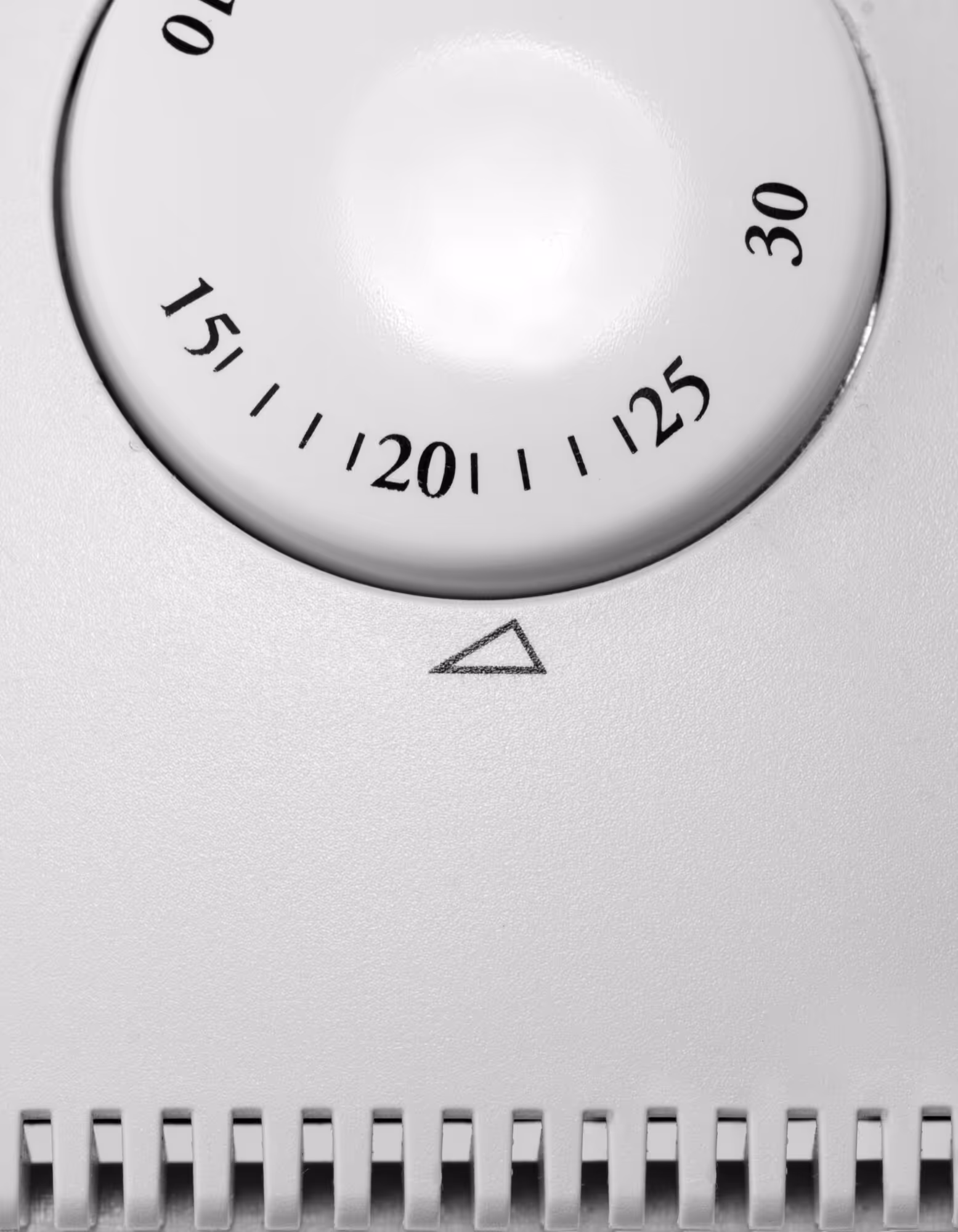 Close-up of a white dial with numbers showing measurement scale